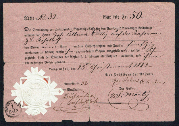 Ein altes deutsches Banknoten mit einem Siegel, Textangabe des Nennwerts, vor einem schwarzen Hintergrund.