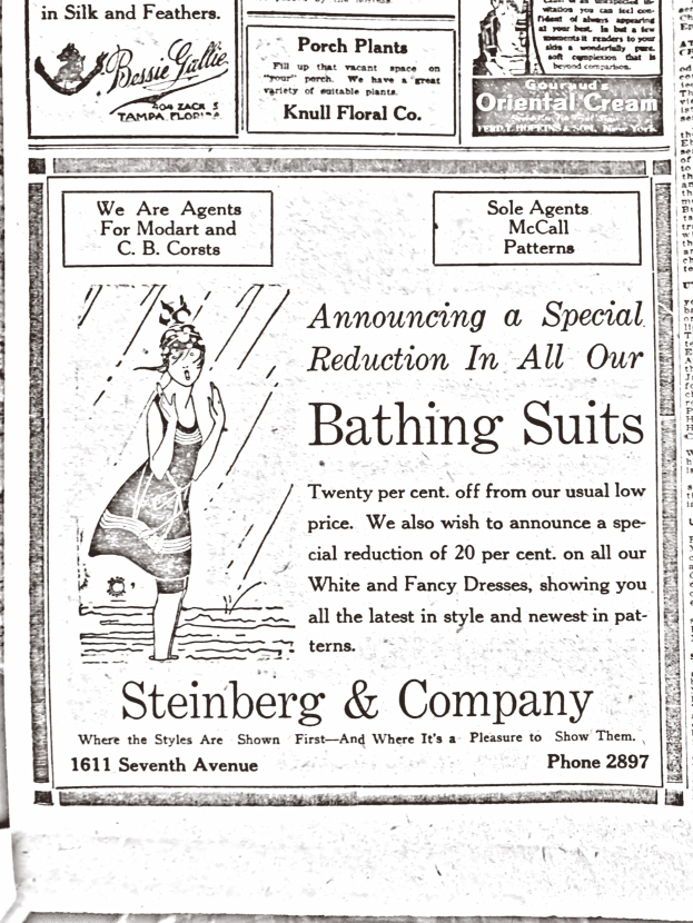 Eine Frau in einem weißen Rollkragenpullover mit langen Ärmeln und einem Dutt, die zentral in einer Werbung für Steinberg & Company's Badesachen steht, mit geschlossenen Augen und friedlichem Gesichtsausdruck.