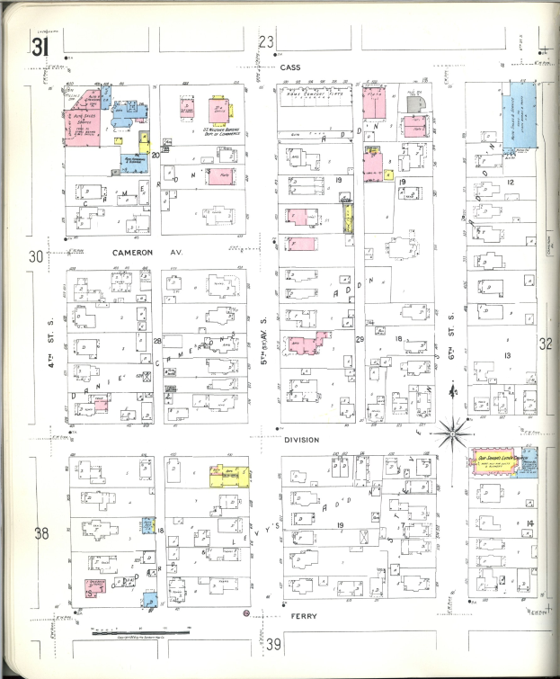 Ein altes Buch mit einer Stadtkarte aus den 1920er Jahren auf dem Cover, das Gebäude, Straßen, Parks und Sehenswürdigkeiten zeigt.
